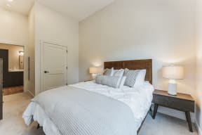 a bedroom with a large bed and a closet