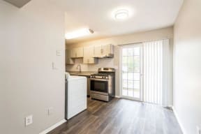 a kitchen with a stove top oven next to a doorway at Courthouse Green Apartments, Chesterfield ,Virginia, 23832
