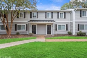 a house with a green lawn and a tree at Courthouse Green Apartments, Chesterfield , VA 23832