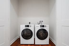 a laundry room with two washing machines in it