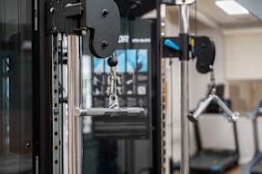 A close up of a weight machine in a gym.