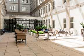 A sunny day at the outdoor seating area of a cafe.