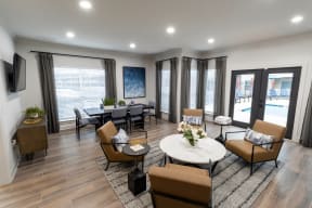 a living room with couches and chairs and a table