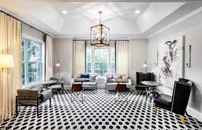 a living room with chairs and tables and a large window at The Pointe at Suwanee Station, Suwanee, GA