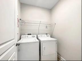 A laundry room with a washer and dryer.