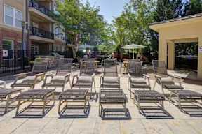 A sunny day at the outdoor seating area of a building.