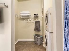 A small laundry room with a washer and dryer.