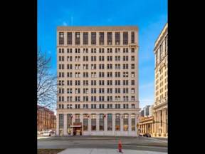 A large building with many windows is in the center of the image.
