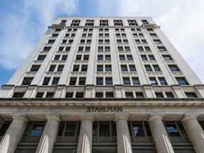 The image shows a tall building with the name