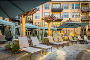 A sunny day at the outdoor seating area of a hotel.