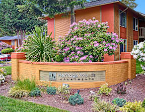 Heritage Woods sign with flowers around it