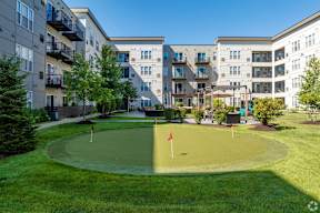 Courtyard putting green surrounded by apartment buildings at Arden of Oak Brook Apartments, Illinois