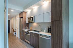 Wooden cabinets and appliances at Artline Apartments, Washington, 20024