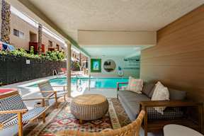 a living room with a pool and a couch