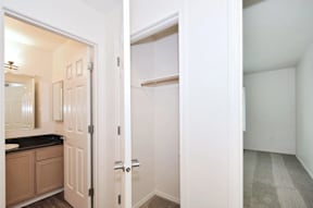 A white door is open to a hallway.