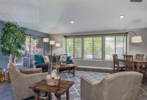 a living room with couches and chairs and a dining room table