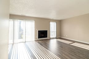 A living room with a fireplace and a television.