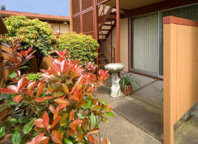 a porch with a fire hydrant in front of a building