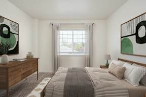 A bedroom with a large bed, a wooden dresser, and two abstract paintings on the wall.