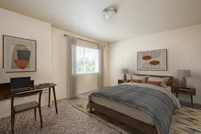 A bedroom with a bed, desk, chair, and a painting on the wall.