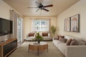 A living room with a brown coffee table and a brown couch.