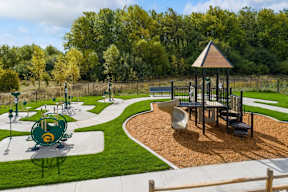 A playground with a green and gold logo in the middle of it.