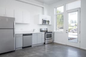 The Lenox | Kitchen Area with Grey Cabinets