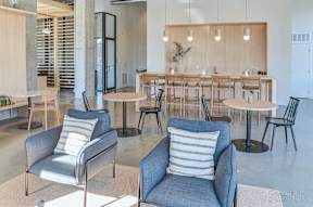 A room with a long table and chairs at The Anthem at Square 10 Apartments, New Haven