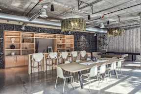 A conference room with a long table and chairs at The Anthem at Square 10 Apartments, New Haven, Connecticut