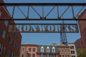a sign that reads brownworks in front of a row of brick buildings  at Iron Works Sono, Connecticut