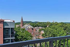 A view of a town from a balcony.