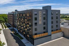 A modern building with the words "Laneway 20 Fair" on the side.