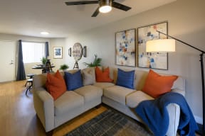 Peoria Apartments- Moxi Apartments-  a living room with a couch and chairs