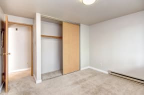 Seattle Apartments-  a bedroom with a large closet, spacious layout
