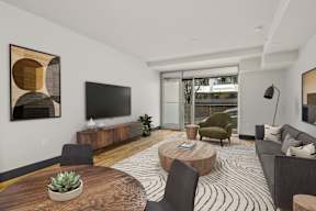 A modern living room with a wooden coffee table and a large abstract painting on the wall.
