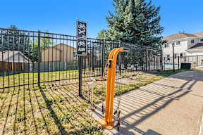 A black fence with a sign that says bike and air.