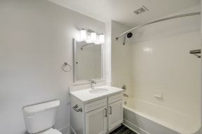 a bathroom with a bathtub and a sink