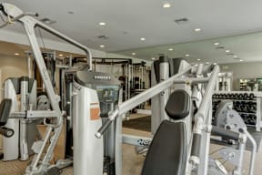 a room filled with lots of different types of exercise equipment