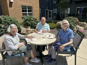 a group of people sitting at a table