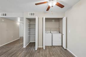 A laundry room with a washer and dryer in it.