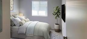 a bedroom with a bed and a window at Silver Creek Apartments, Las Vegas, Nevada