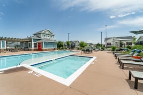Relax at our resort-style pool with lounge chairs at Avilla Eastlake in Thornton, CO.