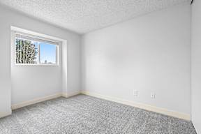A room with a window and carpeted floor at Stony Creek Apartments, Santa Rosa, CA