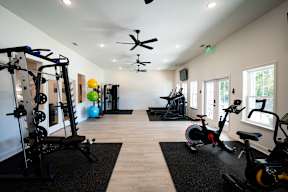 A spacious gym with a variety of exercise equipment.