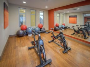 a fitness center with treadmills and other exercise equipment