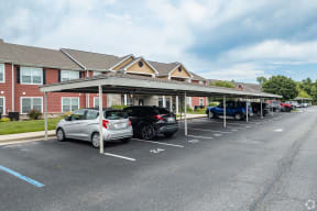a parking lot with cars in front of a building