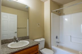 a bathroom with a sink toilet and a shower