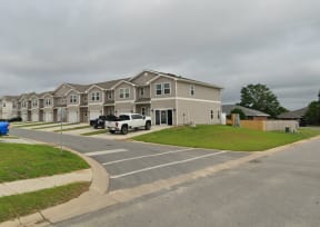 a row of houses with garage doors