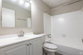 a bathroom with a sink toilet and a tub