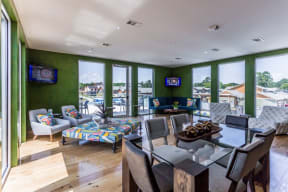 a living room filled with furniture and a large window